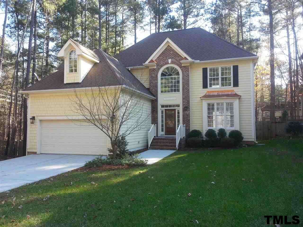 7203 Newport Avenue Raleigh, NC 27613 - Photo 1 of 24 a front view of a house with a yard