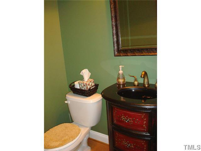 7203 Newport Avenue Raleigh, NC 27613 - Photo 10 of 24 a bathroom with a sink and a toilet