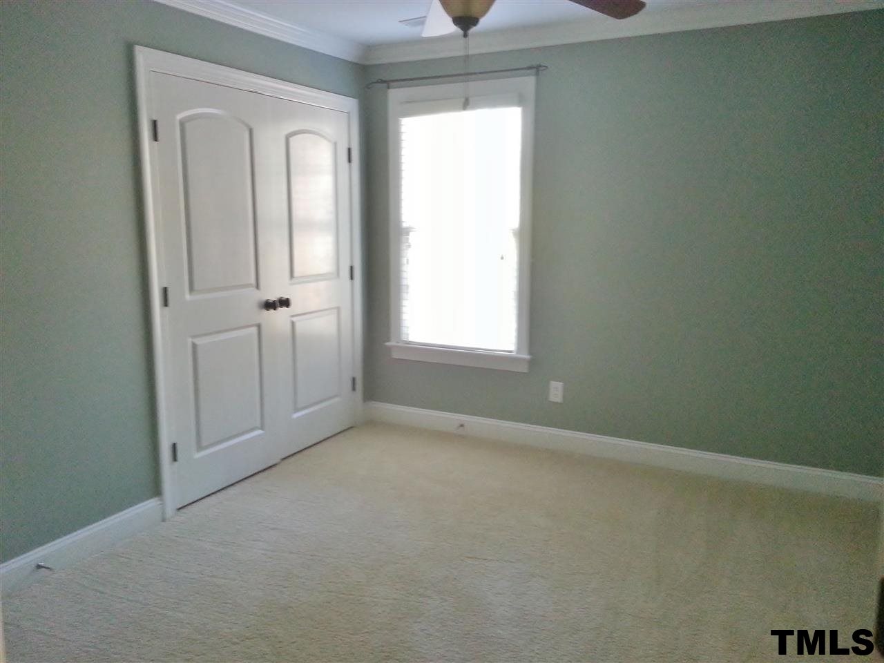 7203 Newport Avenue Raleigh, NC 27613 - Photo 13 of 24 an empty room that has a window