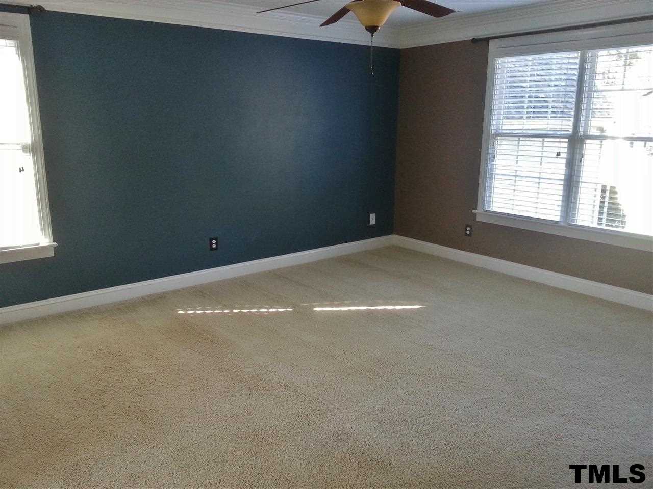 7203 Newport Avenue Raleigh, NC 27613 - Photo 16 of 24 an empty room with a window