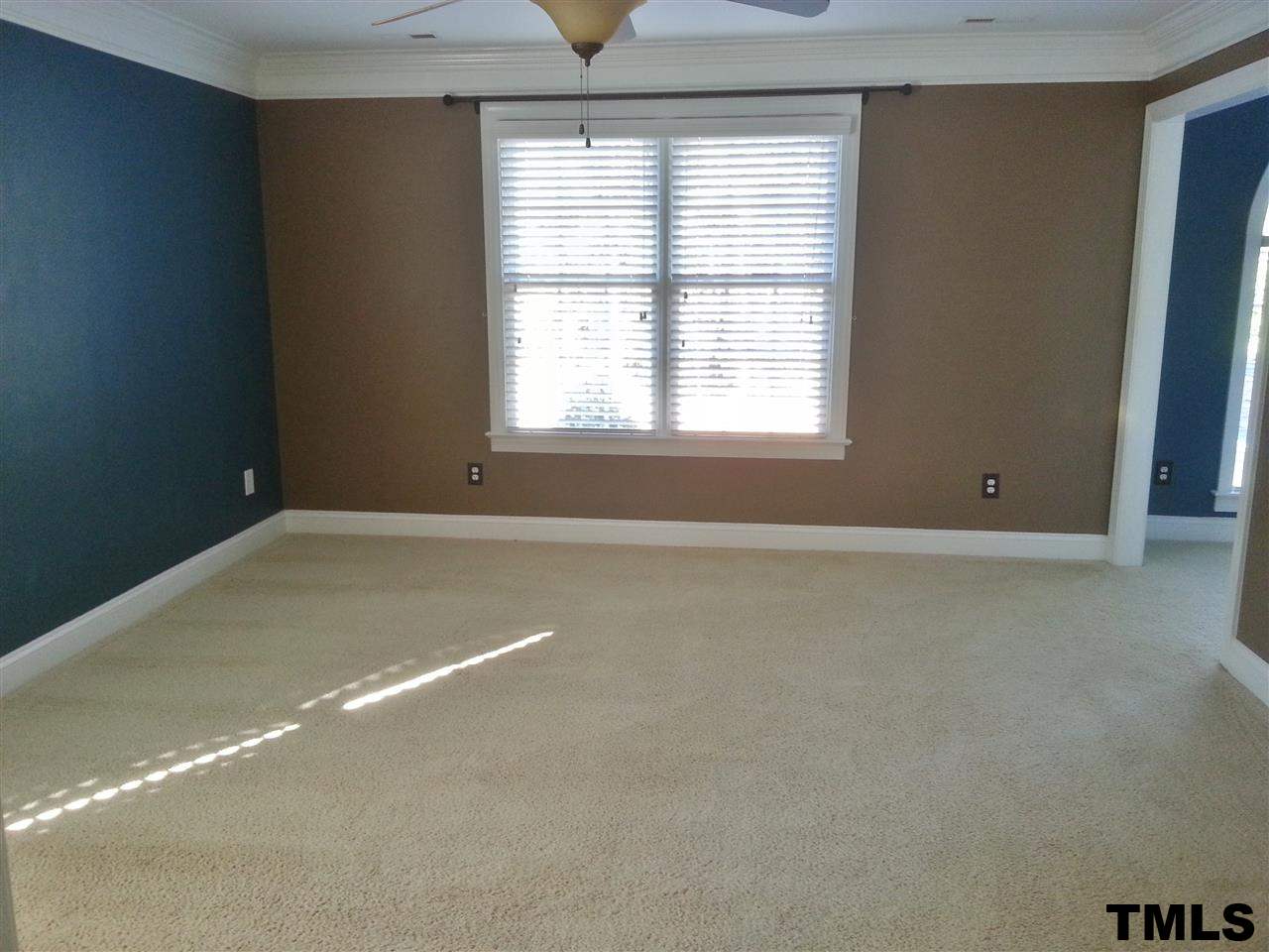 7203 Newport Avenue Raleigh, NC 27613 - Photo 17 of 24 an empty room with a window