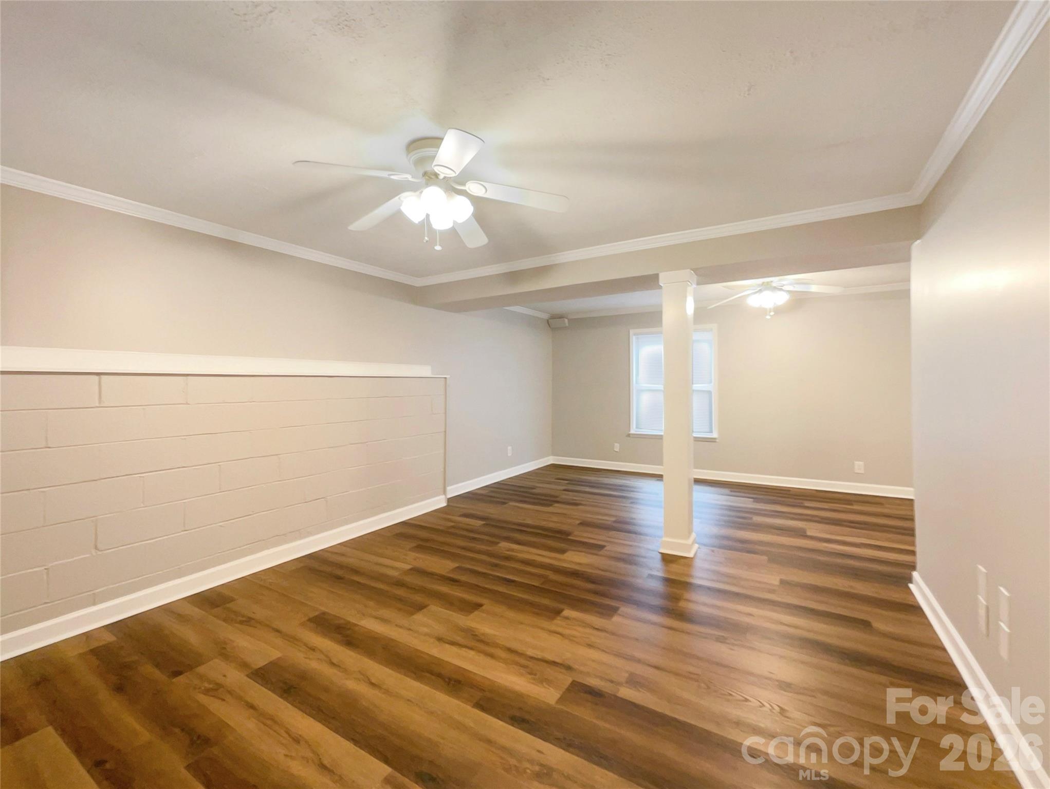231 Fox Hollow Road Mooresville, NC 28117 - Photo 17 of 20 a view of empty room with wooden floor and fan