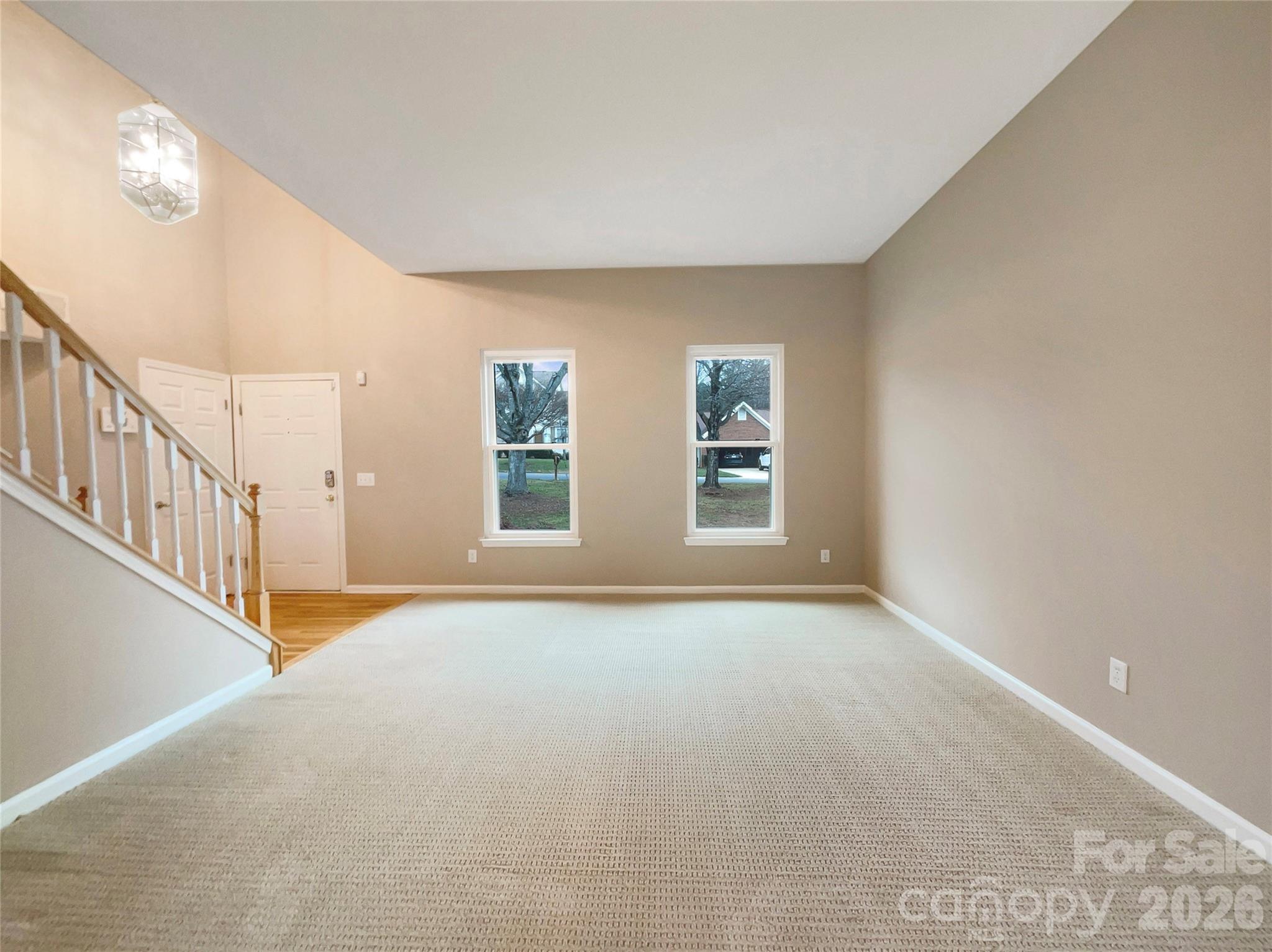 231 Fox Hollow Road Mooresville, NC 28117 - Photo 3 of 20 a view of an empty room with windows