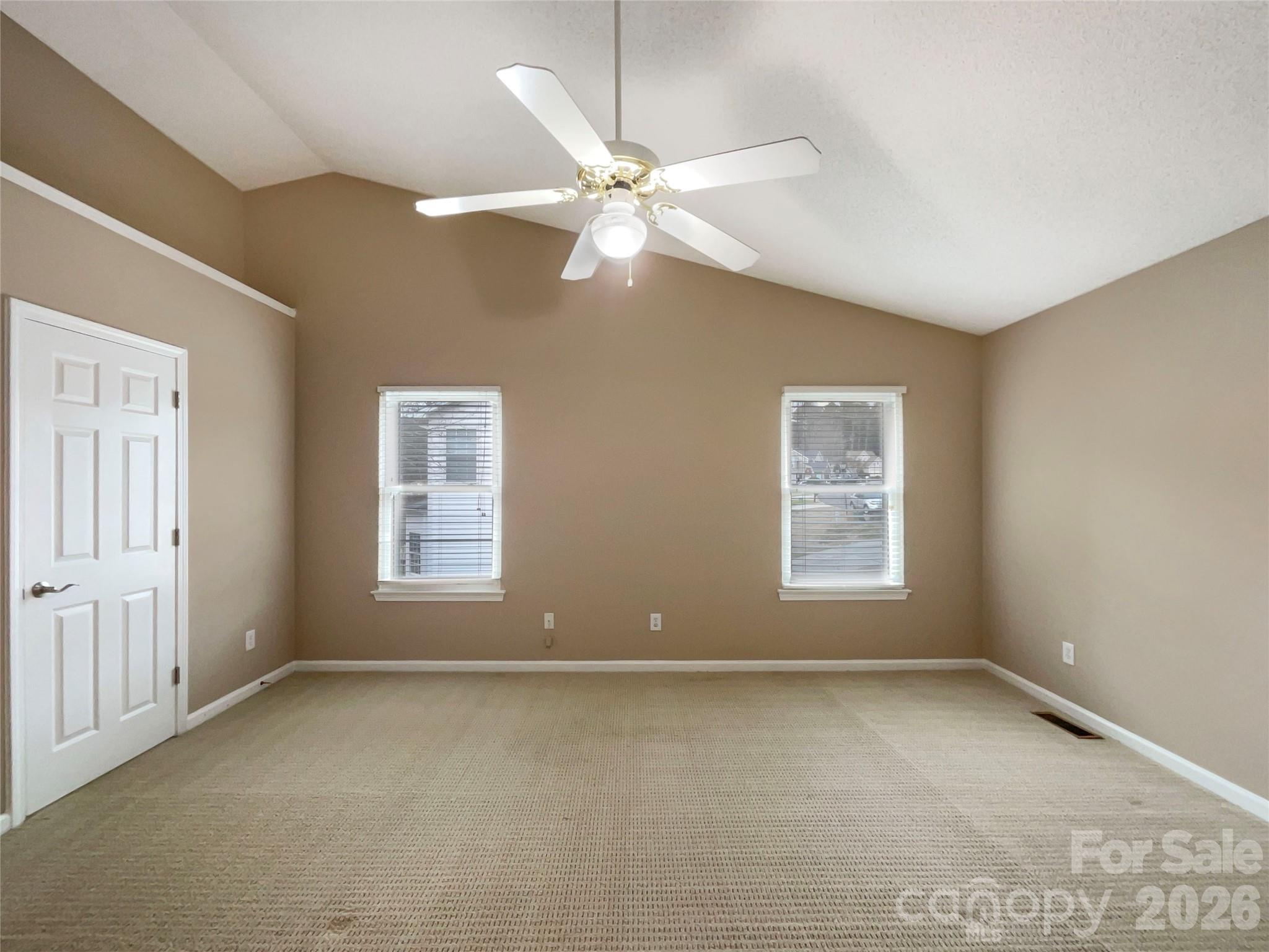 231 Fox Hollow Road Mooresville, NC 28117 - Photo 6 of 20 an empty room with a window and a fan