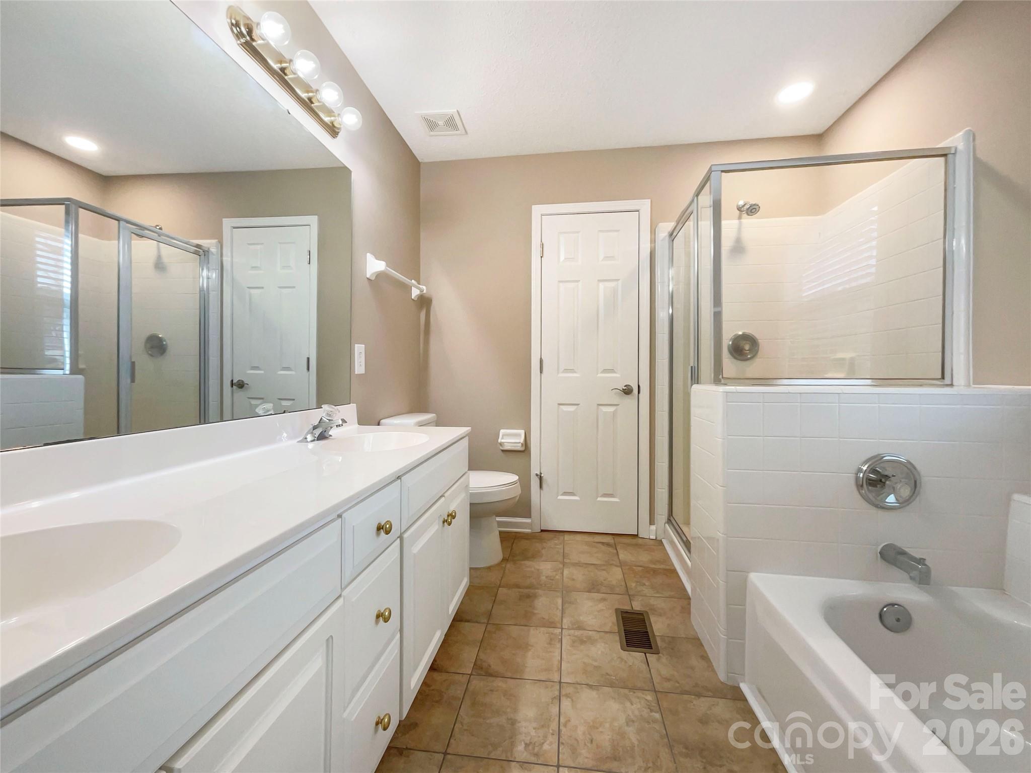 231 Fox Hollow Road Mooresville, NC 28117 - Photo 7 of 20 a spacious bathroom with a tub sink shower and mirror