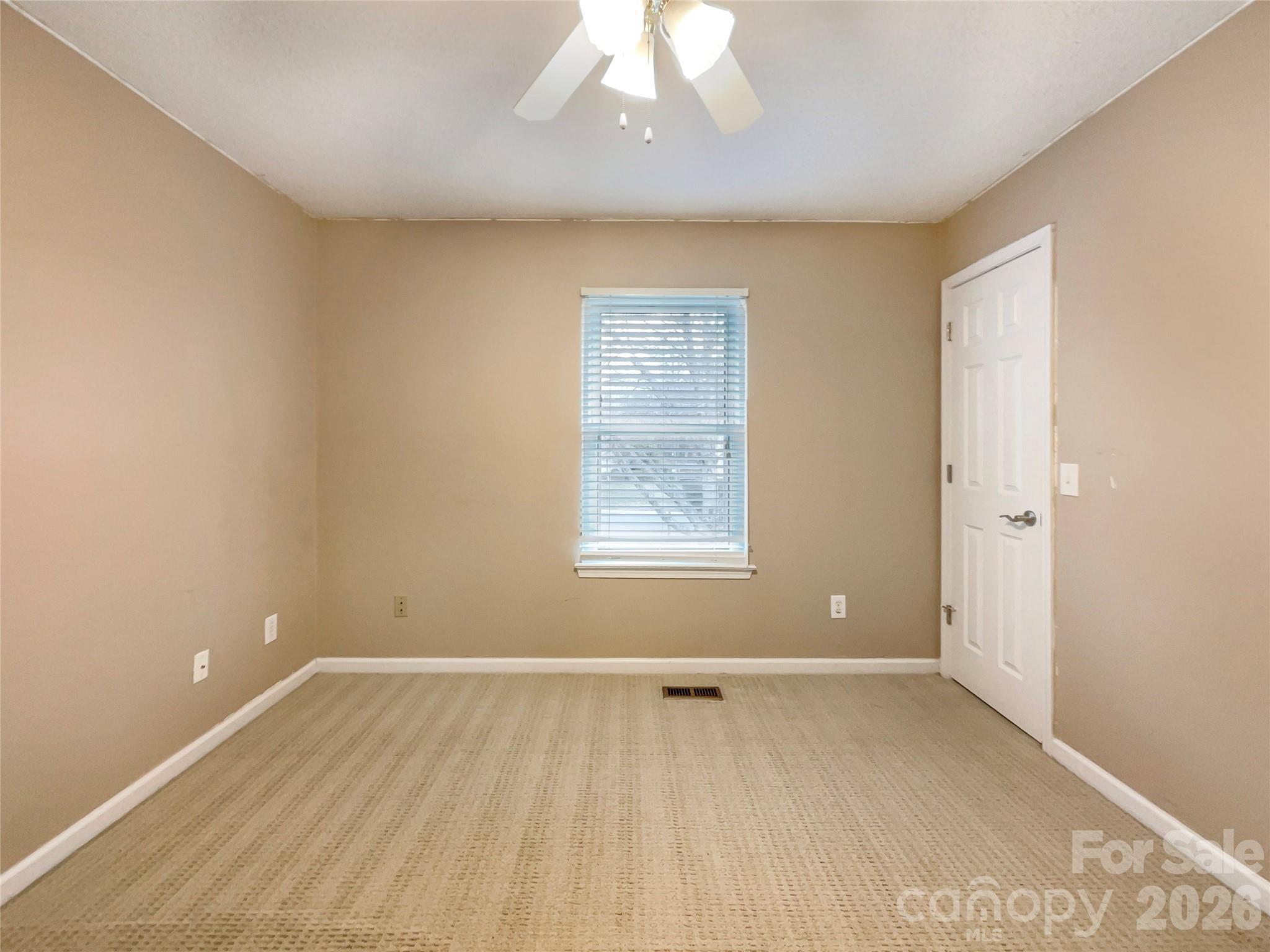 231 Fox Hollow Road Mooresville, NC 28117 - Photo 8 of 20 an empty room with a window