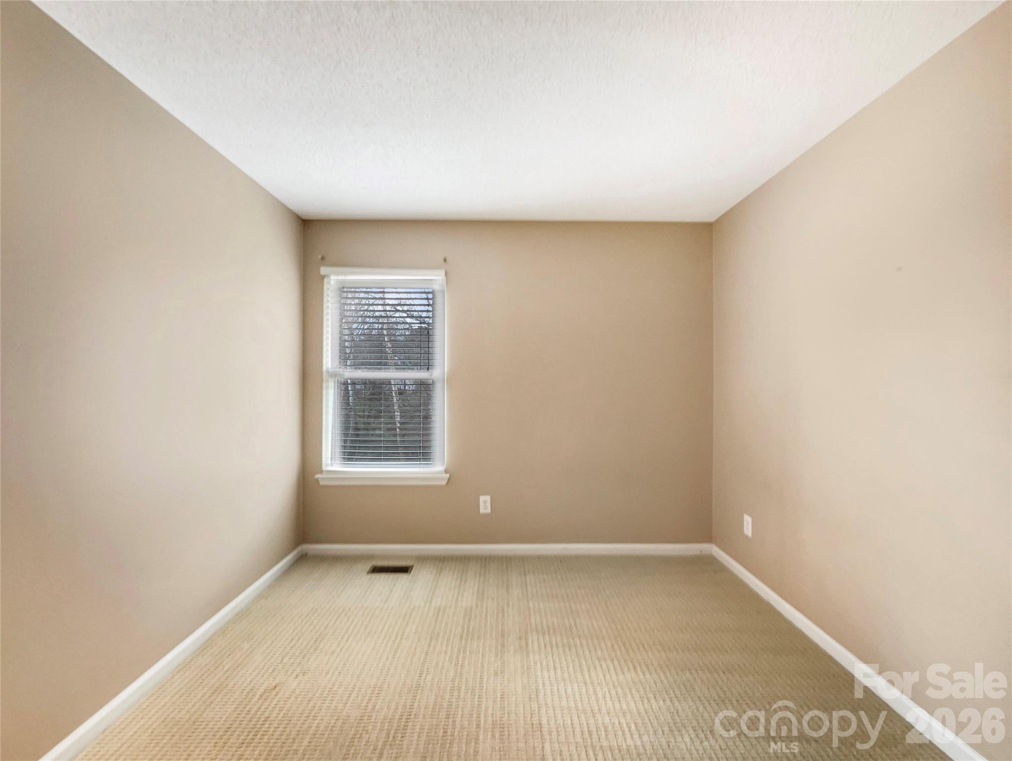 231 Fox Hollow Road Mooresville, NC 28117 - Photo 9 of 20 a view of an empty room with a window