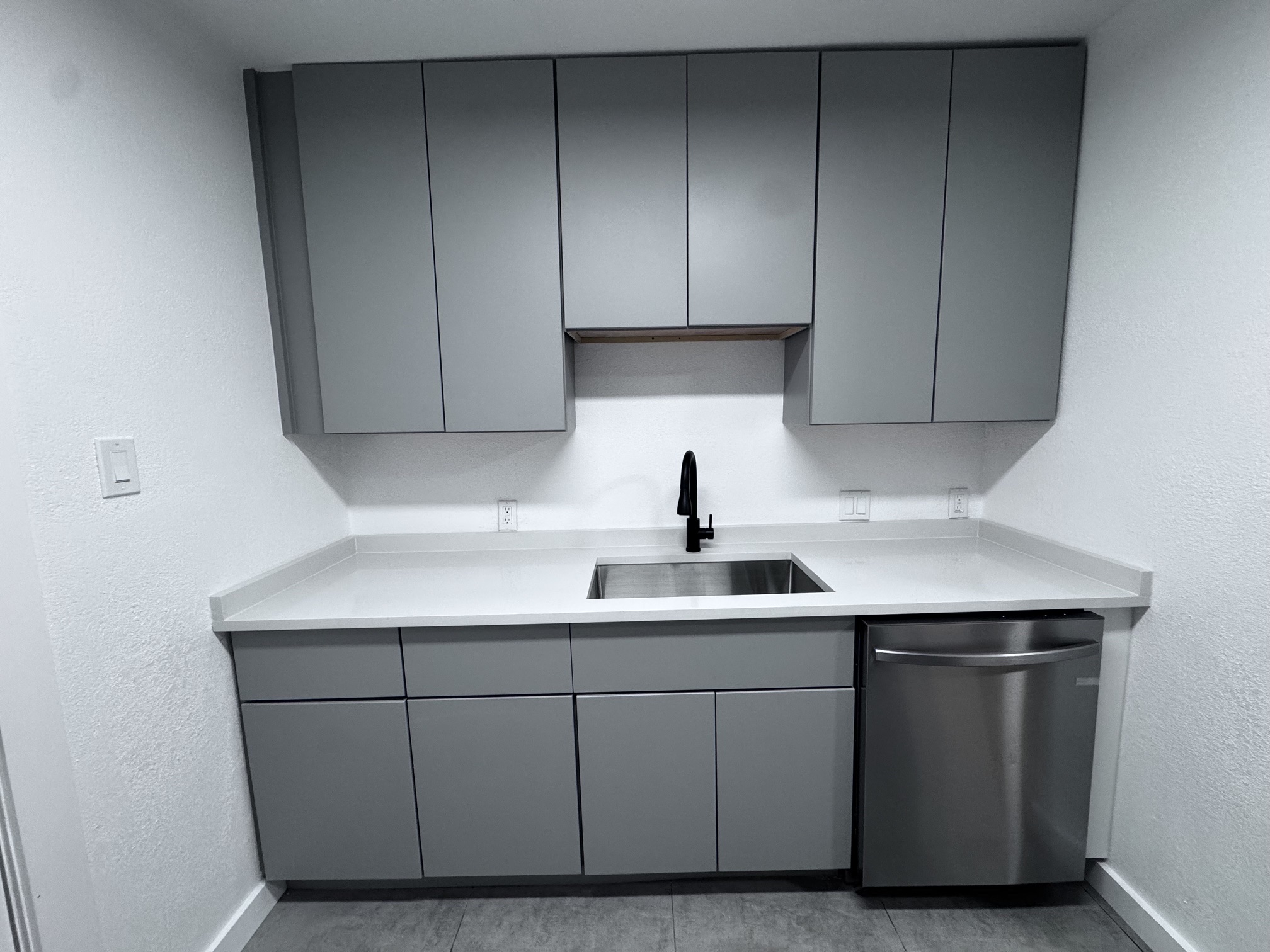 4908 Hawk Cove, Unit 2 Austin, TX 78745 - Photo 8 of 17 a kitchen with a sink and cabinets