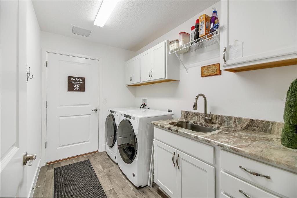 3323 Rohan Road Oxford, FL 34484 - Photo 17 of 46 a kitchen with a sink and cabinets