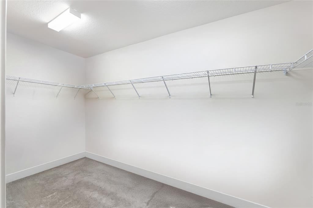 3323 Rohan Road Oxford, FL 34484 - Photo 22 of 46 a view of a room with racks on the wall