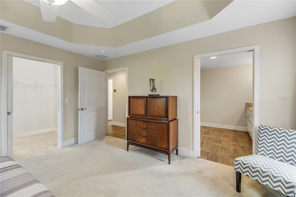 3323 Rohan Road Oxford, FL 34484 - Photo 23 of 46 a living room with furniture and a refrigerator