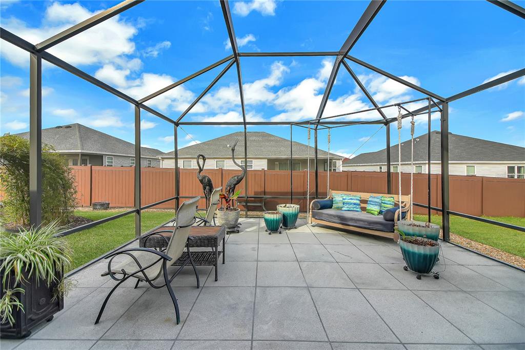 3323 Rohan Road Oxford, FL 34484 - Photo 29 of 46 a view of a chairs and table in the patio