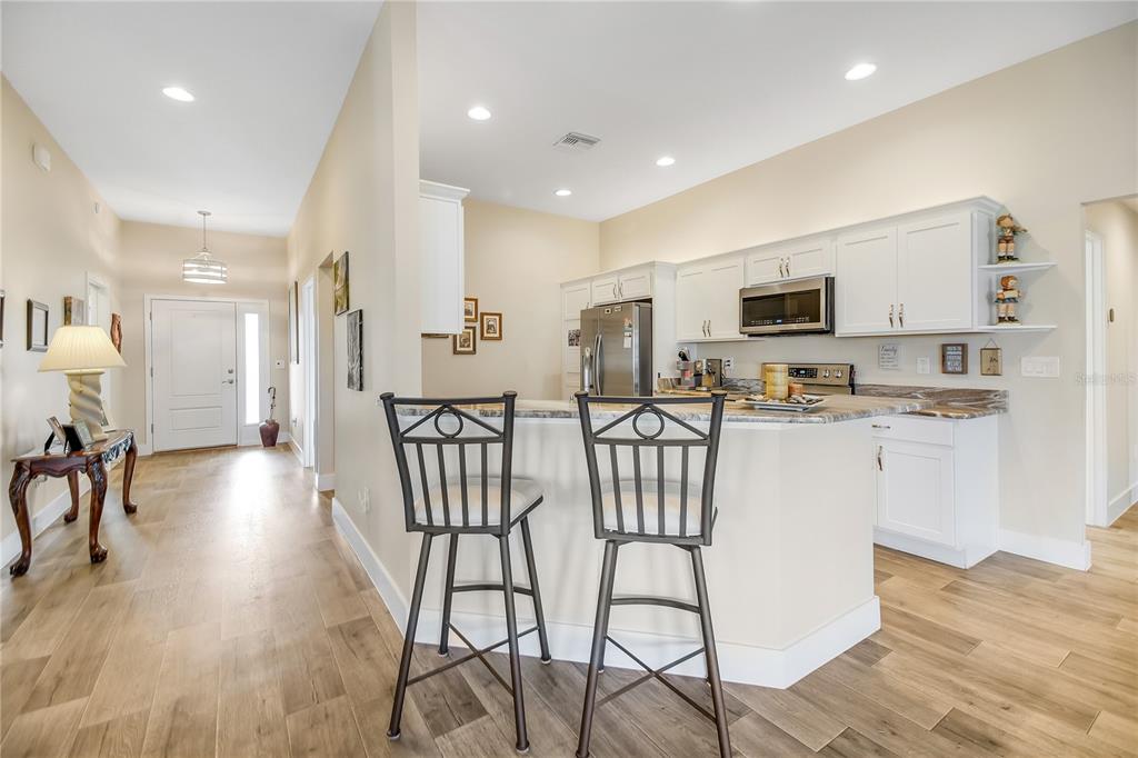 3323 Rohan Road Oxford, FL 34484 - Photo 35 of 46 a kitchen with counter space cabinets and appliances