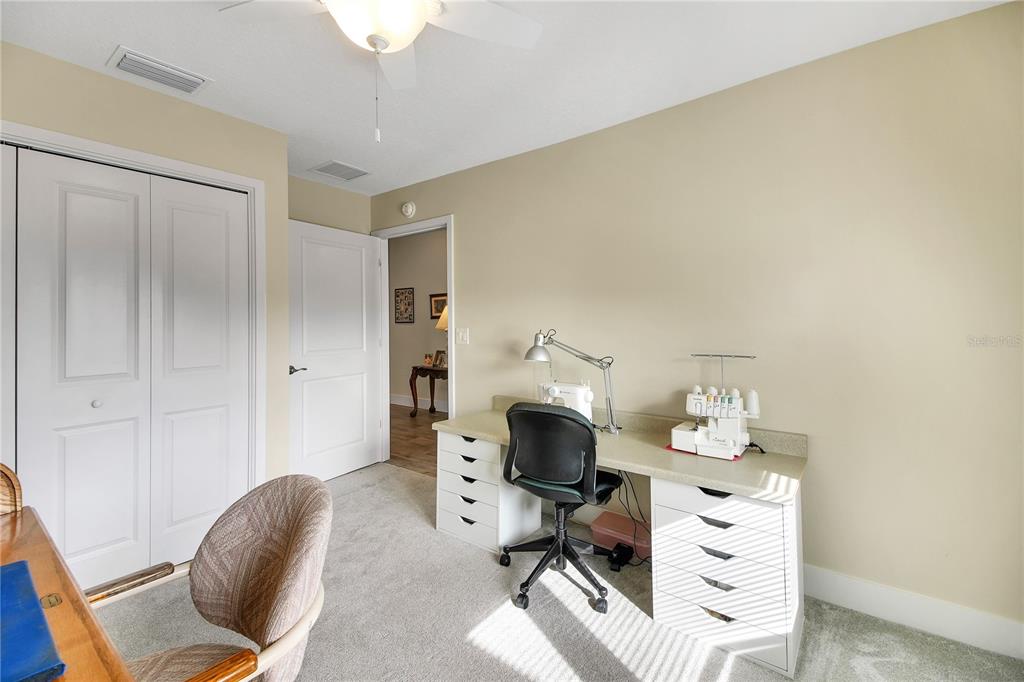 3323 Rohan Road Oxford, FL 34484 - Photo 45 of 46 a workspace with furniture and chandelier