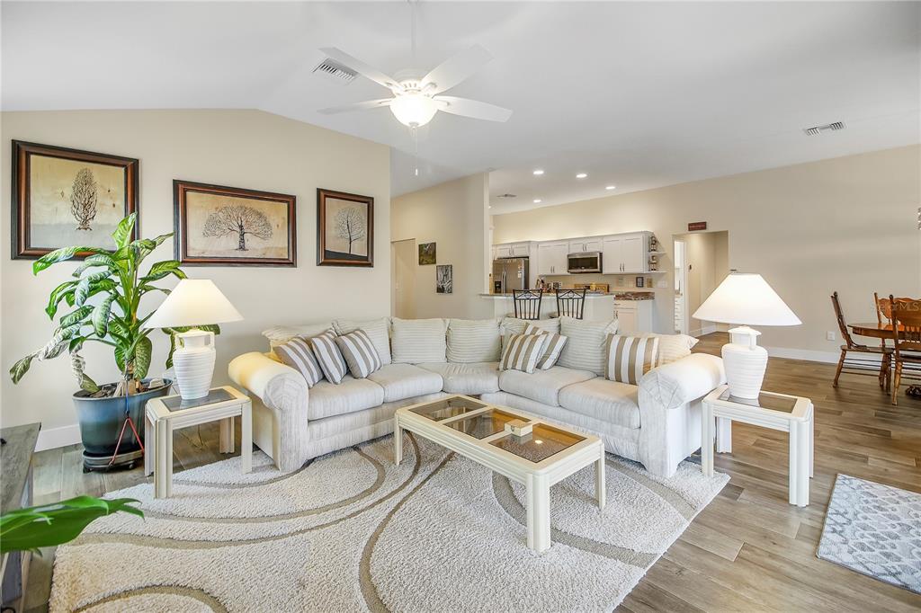 3323 Rohan Road Oxford, FL 34484 - Photo 9 of 46 a living room with furniture and wooden floor