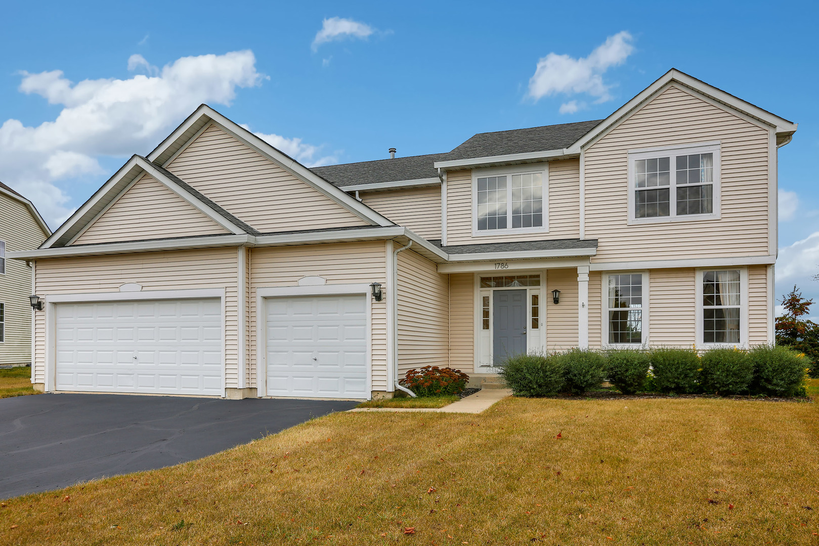1786 Prairie Ridge Circle Lindenhurst, IL 60046 - Photo 1 of 34 a front view of a house with a yard and garage