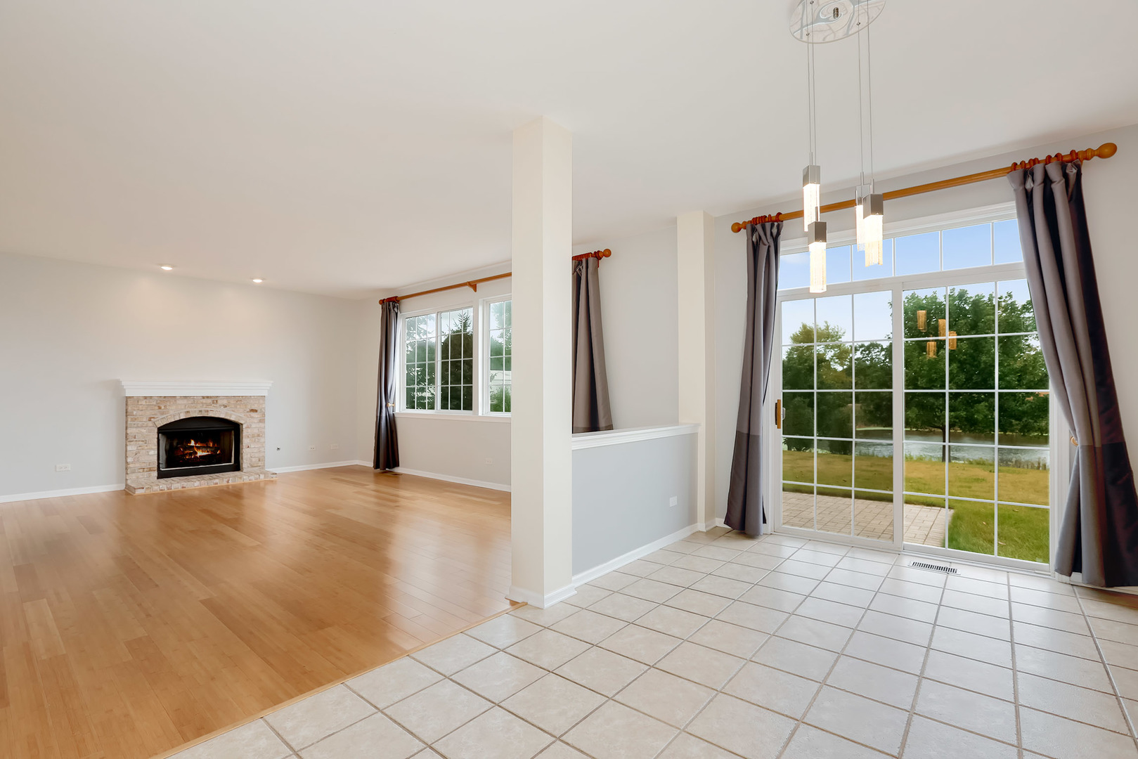 1786 Prairie Ridge Circle Lindenhurst, IL 60046 - Photo 15 of 34 a view of an empty room with window and chandelier fan