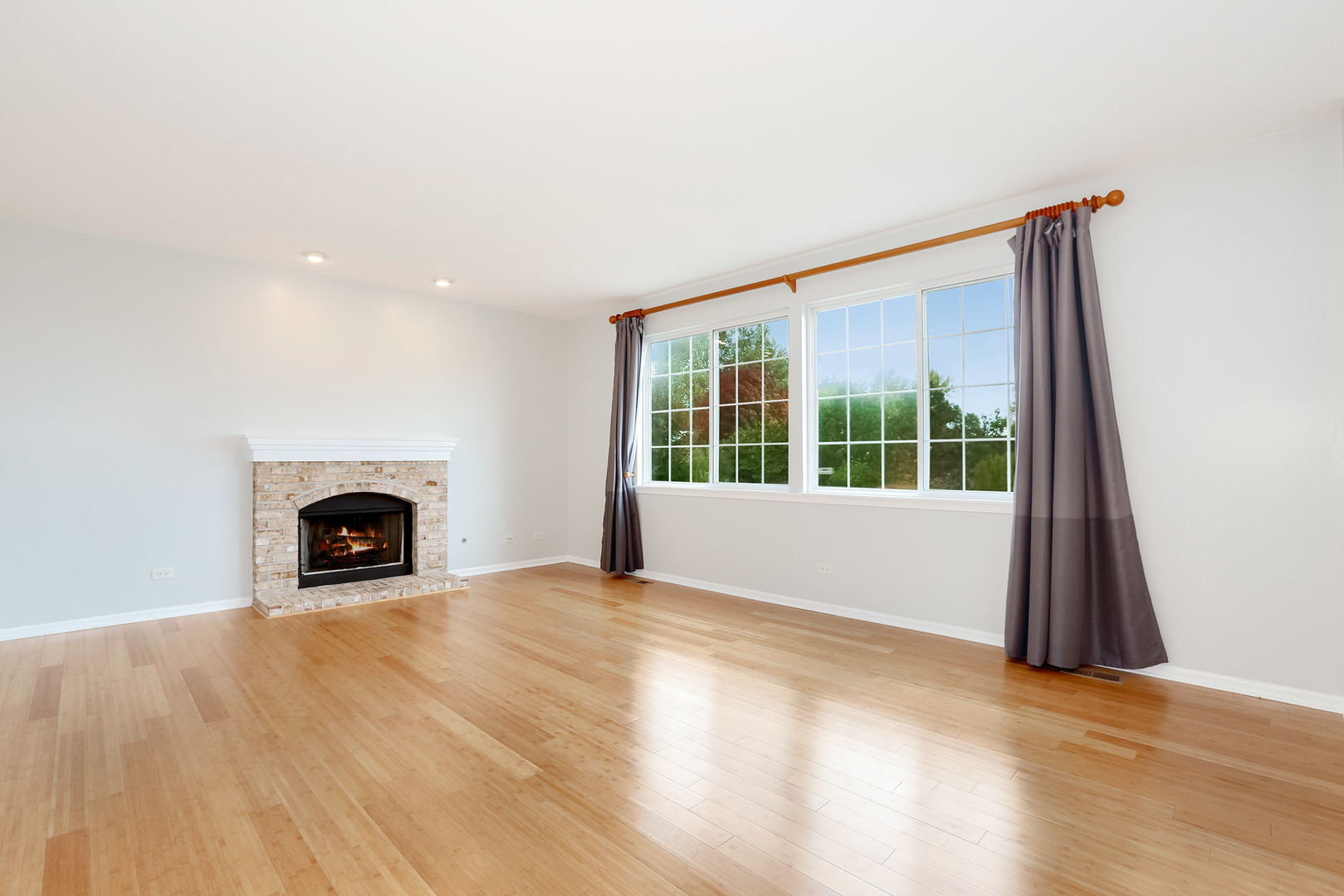 1786 Prairie Ridge Circle Lindenhurst, IL 60046 - Photo 16 of 34 a view of an empty room with a window and fireplace