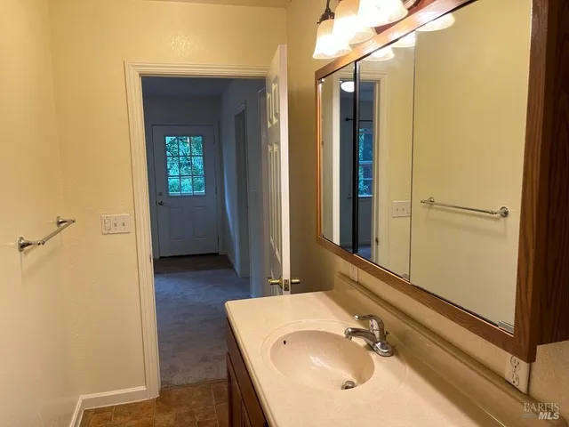a bathroom with a sink and a mirror