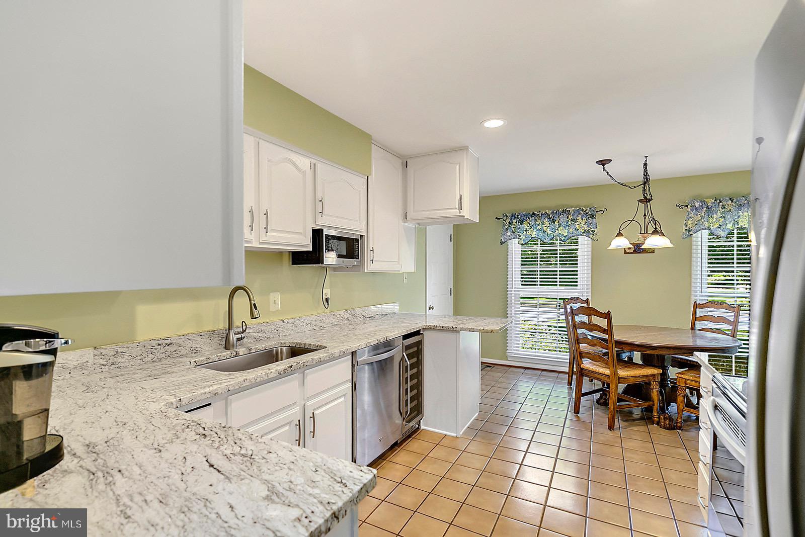 8804 Side Saddle Road Springfield, VA 22152 - Photo 11 of 37 Kitchen w/Granite Countertops & Breakfast Room