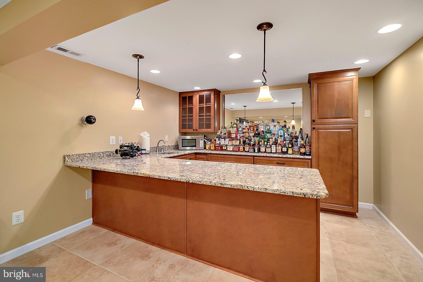 8804 Side Saddle Road Springfield, VA 22152 - Photo 28 of 37 Basement w/Built-In Bar and Stepped Shelving