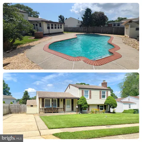 a view of multiple houses with a yard