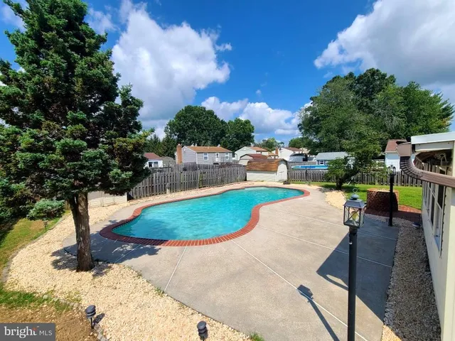 a view of a backyard with sitting area