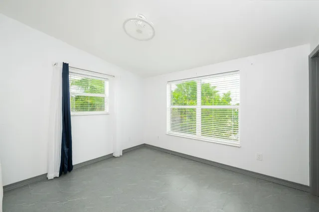 an empty room with windows