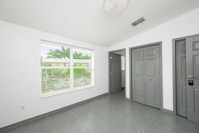 a view of an empty room with a window