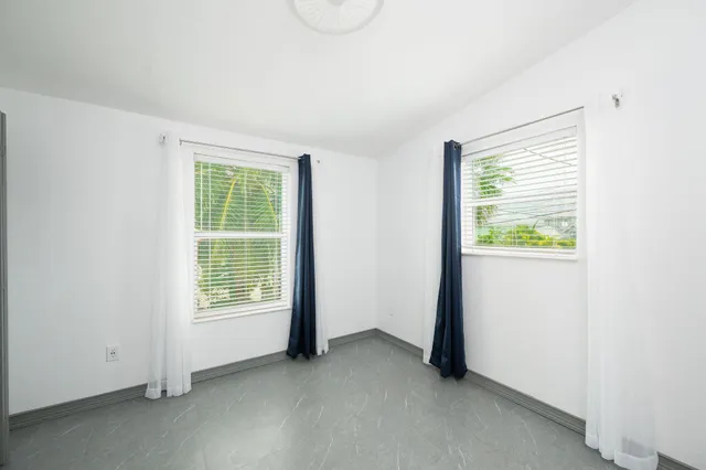 an empty room with windows