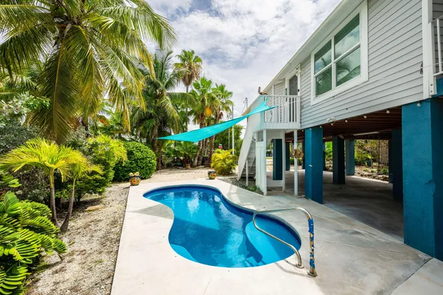 a view of a house with swimming pool