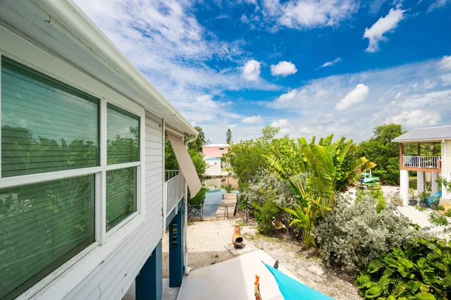 a view of a balcony with plants