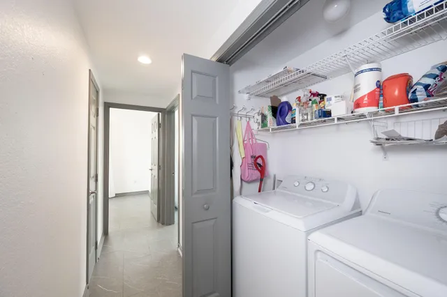 a storage room with washer and dryer