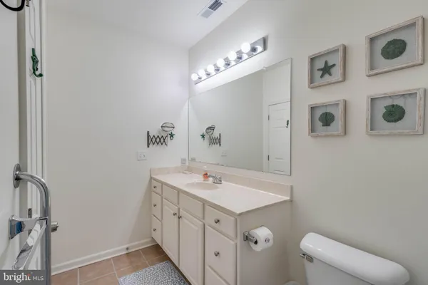 a bathroom with a sink a vanity and a mirror