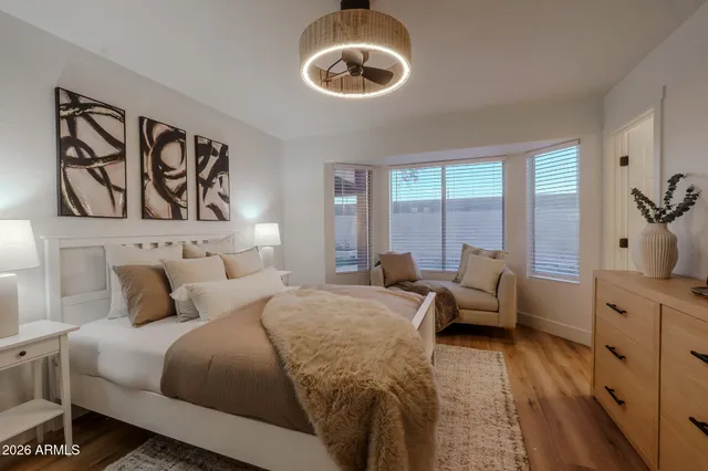 a bedroom with a bed and window