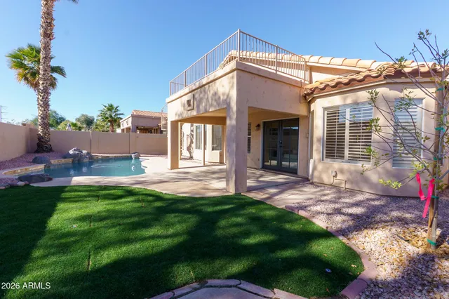 a view of a house with pool porch and sitting area