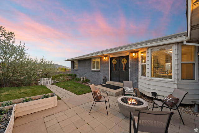 9750 Indian Ridge Drive Sandy, UT 84092 - Photo 8 of 40 View of patio / terrace with an outdoor fire pit and french doors