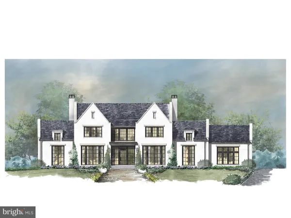 a view of a white house next to a yard