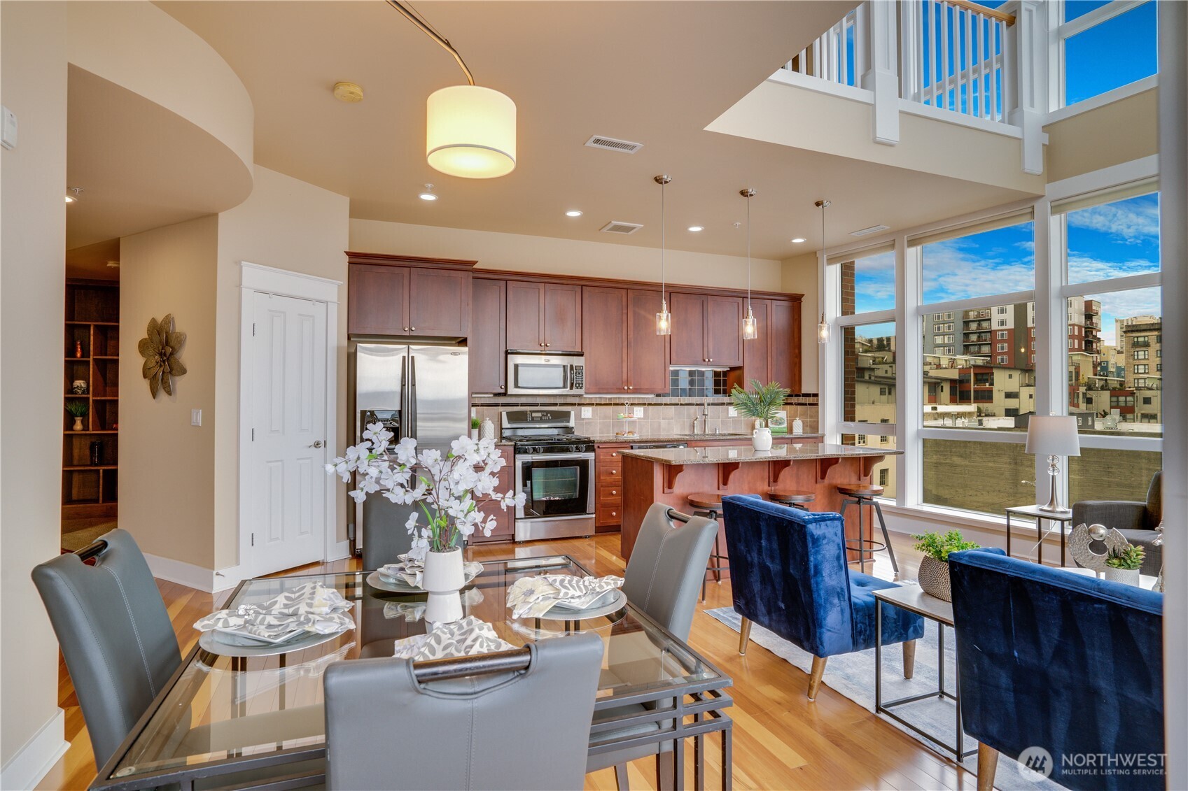 708 Market Street, Unit 705 Tacoma, WA 98402 - Photo 7 of 38 a view of a dining room with furniture window and wooden floor