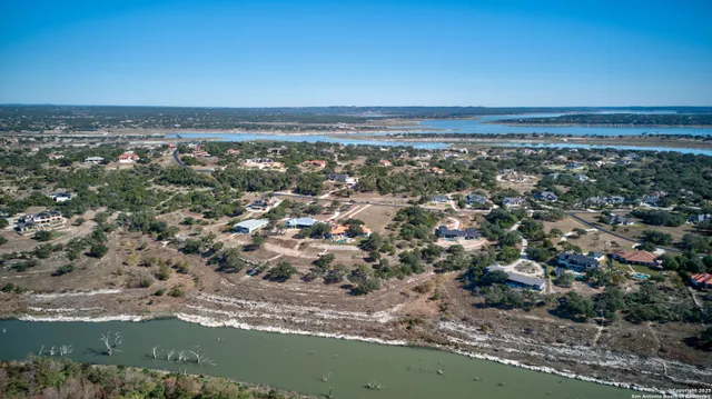 an aerial view of a house with a lake view