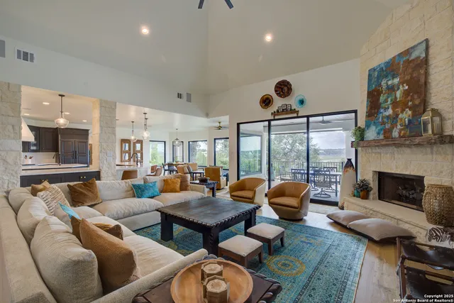 a living room with furniture and a fireplace
