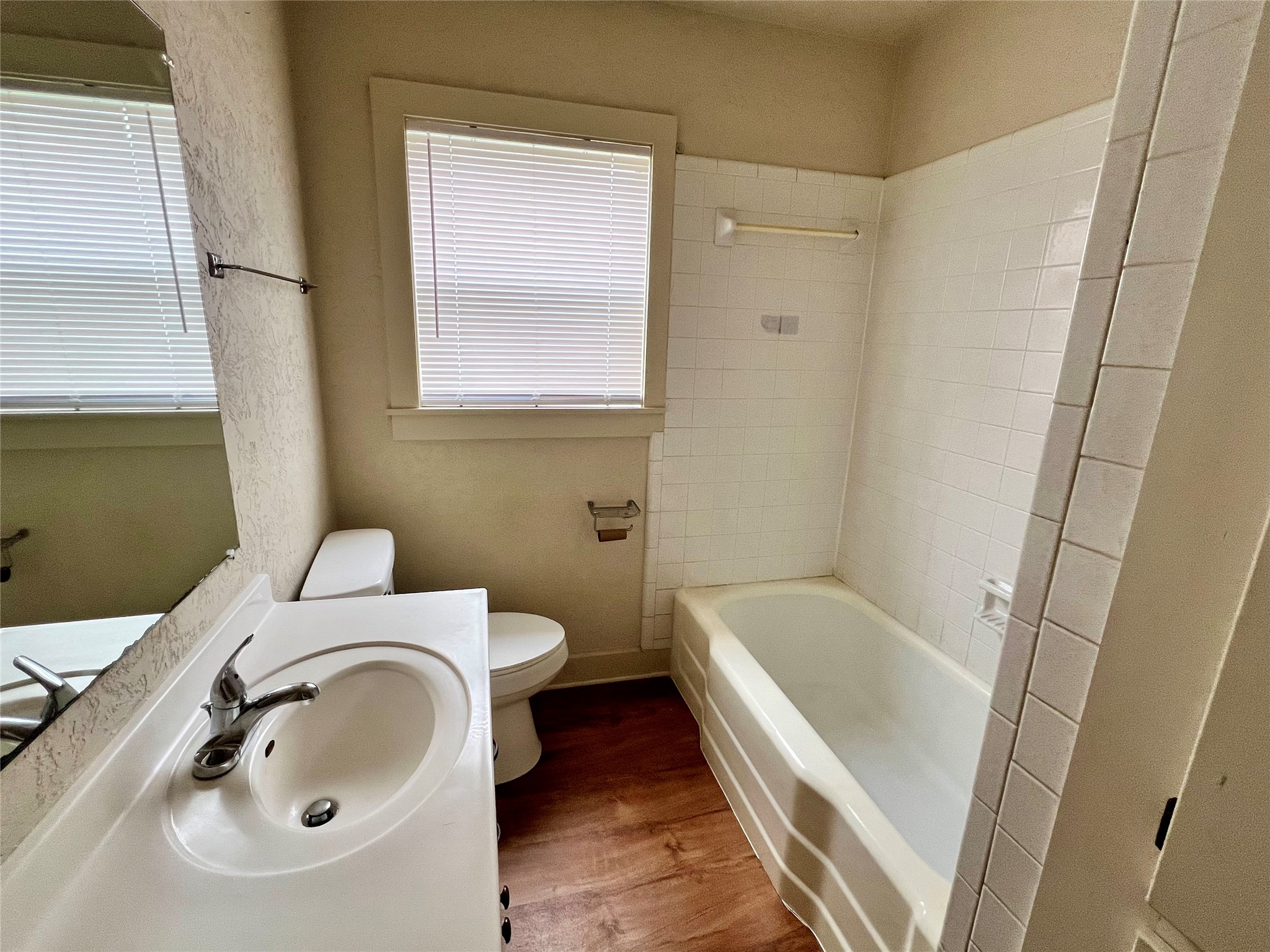 502 West Third Street Brenham, TX 77833 - Photo 8 of 10 a bathroom with a sink and a bathtub
