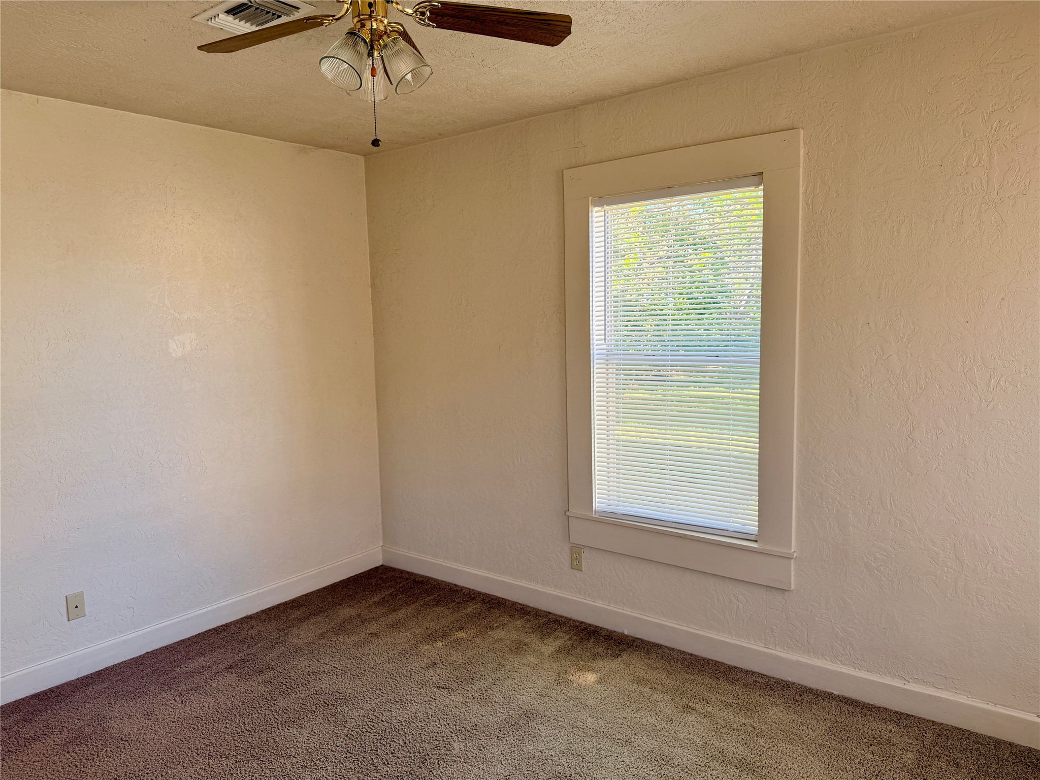 502 West Third Street Brenham, TX 77833 - Photo 10 of 10 an empty room with a window