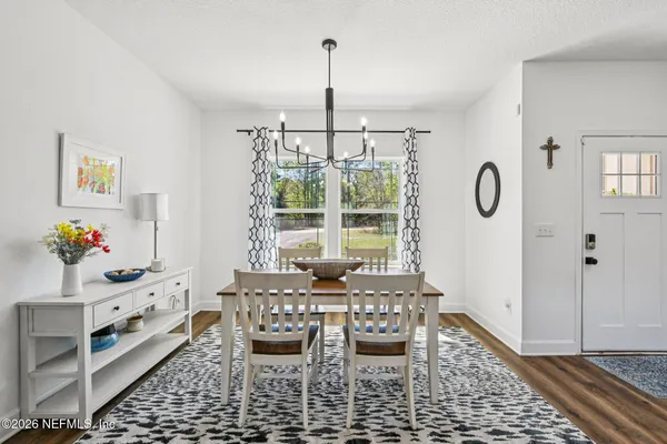 a view of a dining room with furniture
