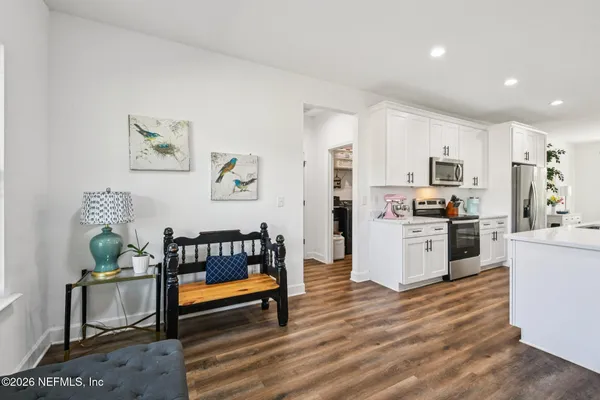 a bathroom with double vanity sink and a mirror