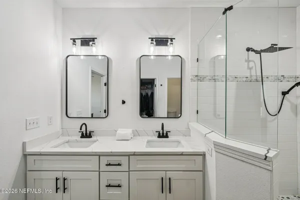 a view of an entryway with wooden floor