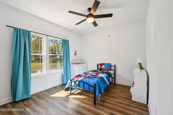 a bedroom with a bed and a dresser