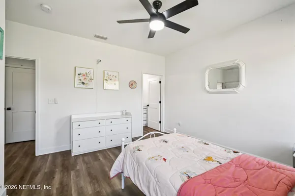 a view of a field with an trees