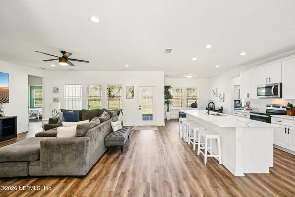 a living room with furniture and a fireplace