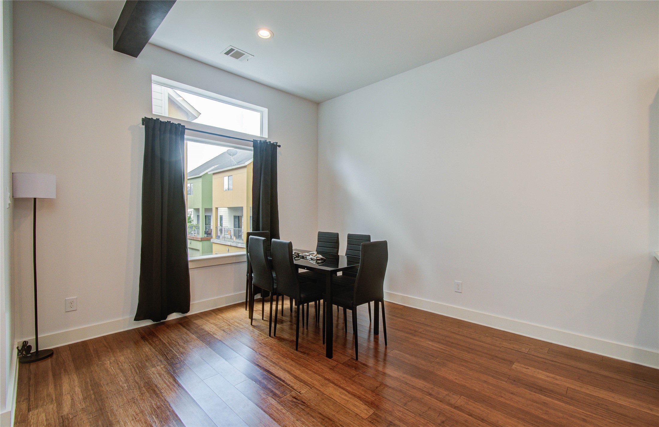 4311 Marina Street Houston, TX 77007 - Photo 17 of 42 a view of a dining room with furniture and wooden floor